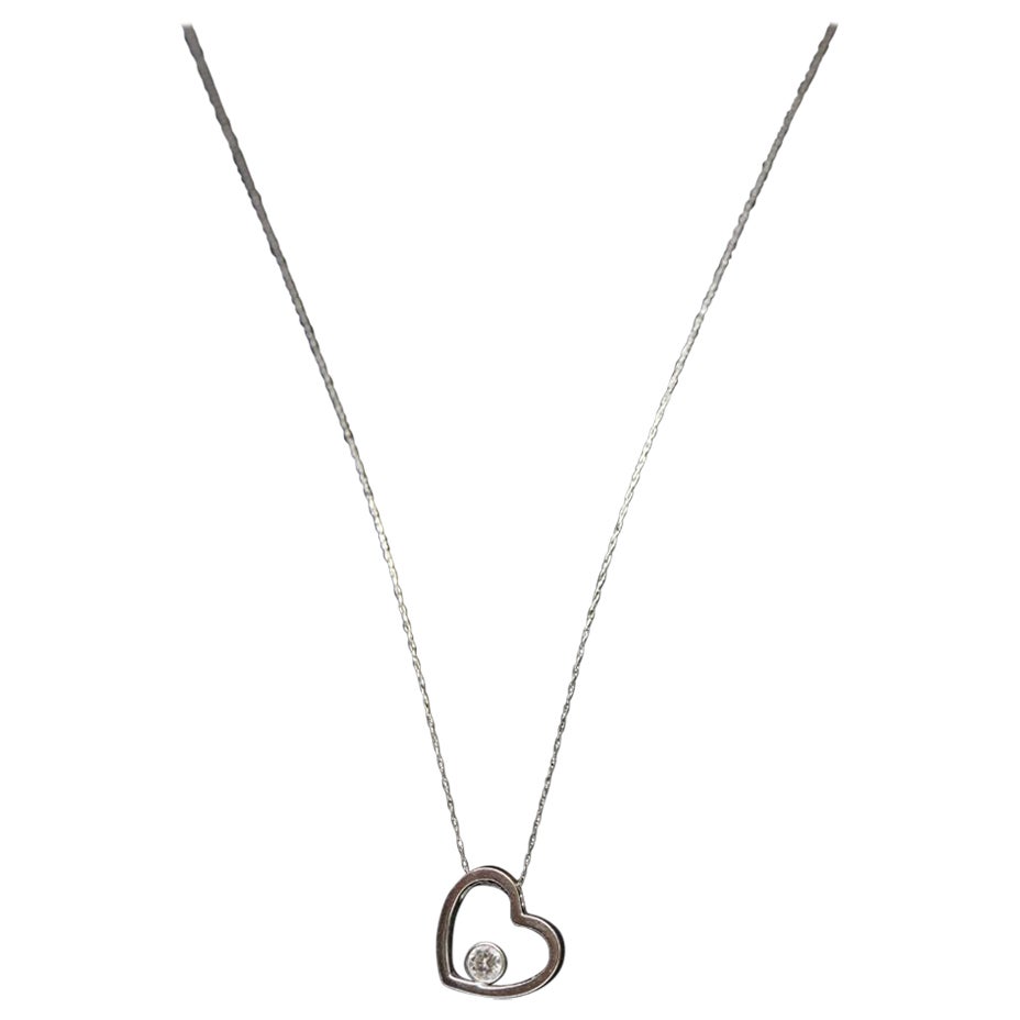 18k Open Heart 0.21ct Diamond Solitaire pendant. 14k 20in thin necklace. Bezel
