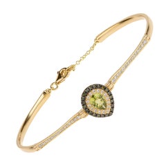 Peridot-Armband im Birnenschliff aus 18 Karat Gold mit blauen und weißen Pavé-Diamanten