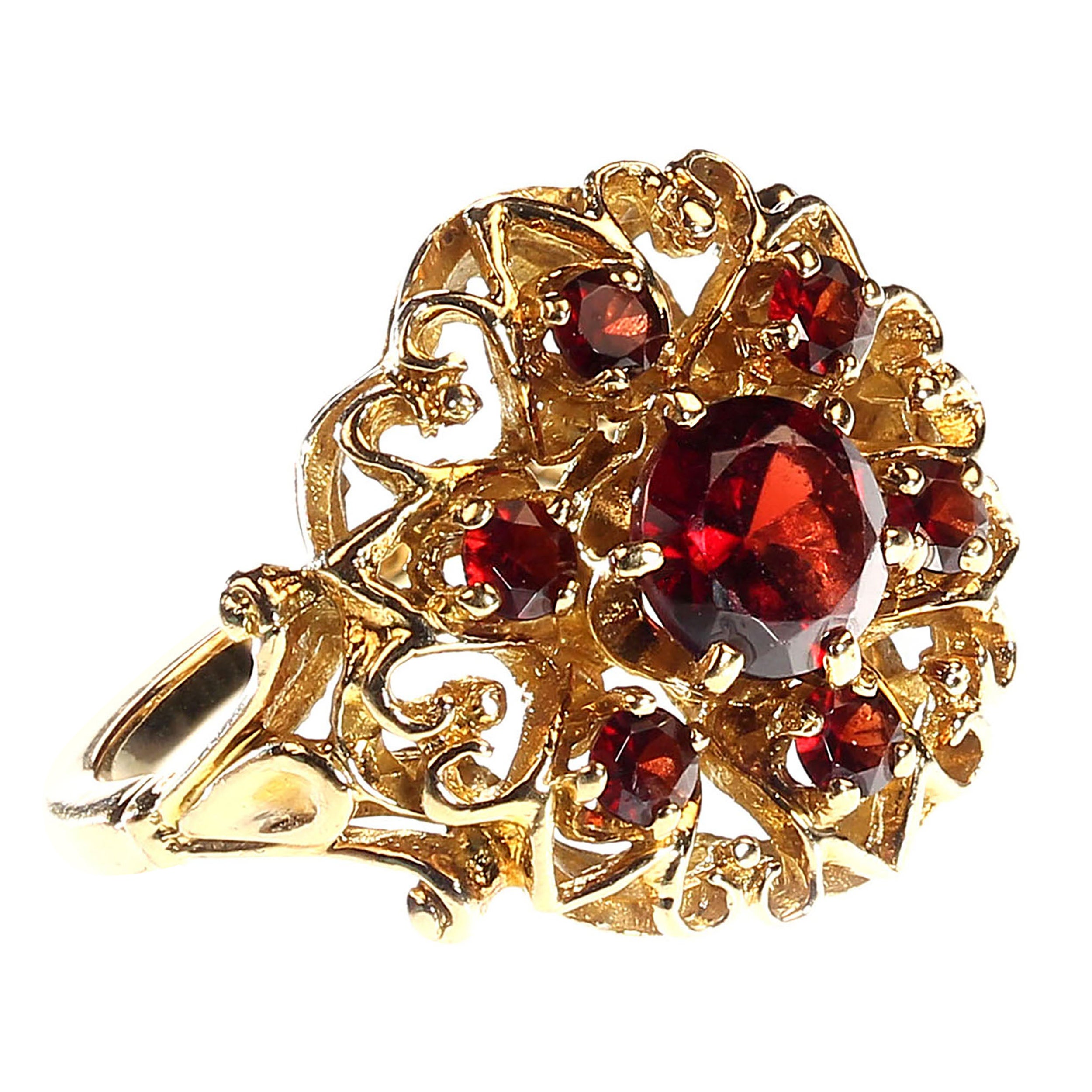 Exquisite Vintage 14K Yellow Gold Garnet Ring – Orange Blossom Setting
Discover the allure of this lovely vintage ring, elegantly crafted in 14K rich yellow gold. The stunning orange blossom setting beautifully showcases a central round garnet,