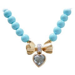Collana in turchese, topazio, diamanti, oro giallo 18 carati.
