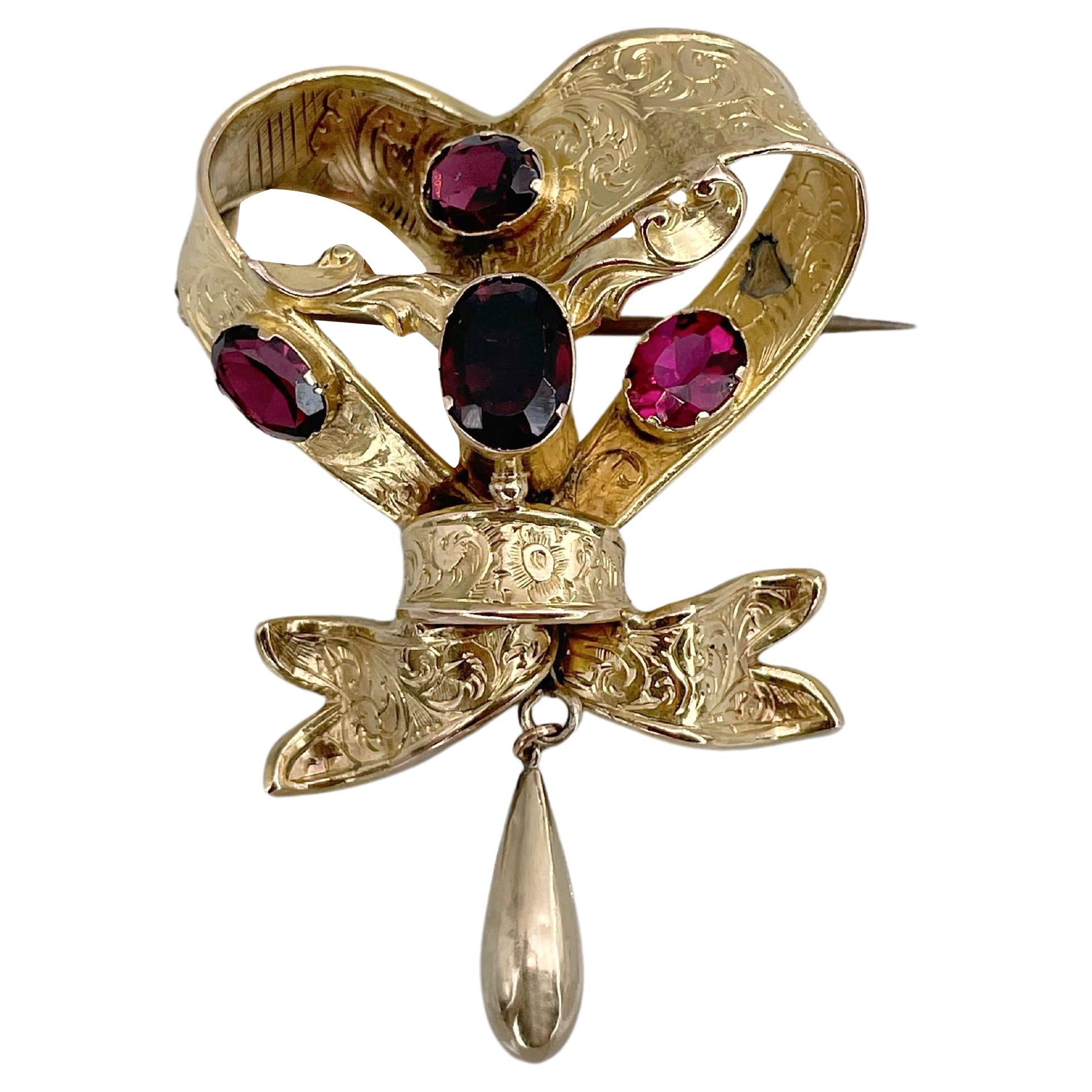 Victorian 9 Karat Yellow Gold Garnet Bow Pin Brooch For Sale