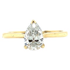 Pear shaped diamond classic solitaire engagement ring 18k yellow gold