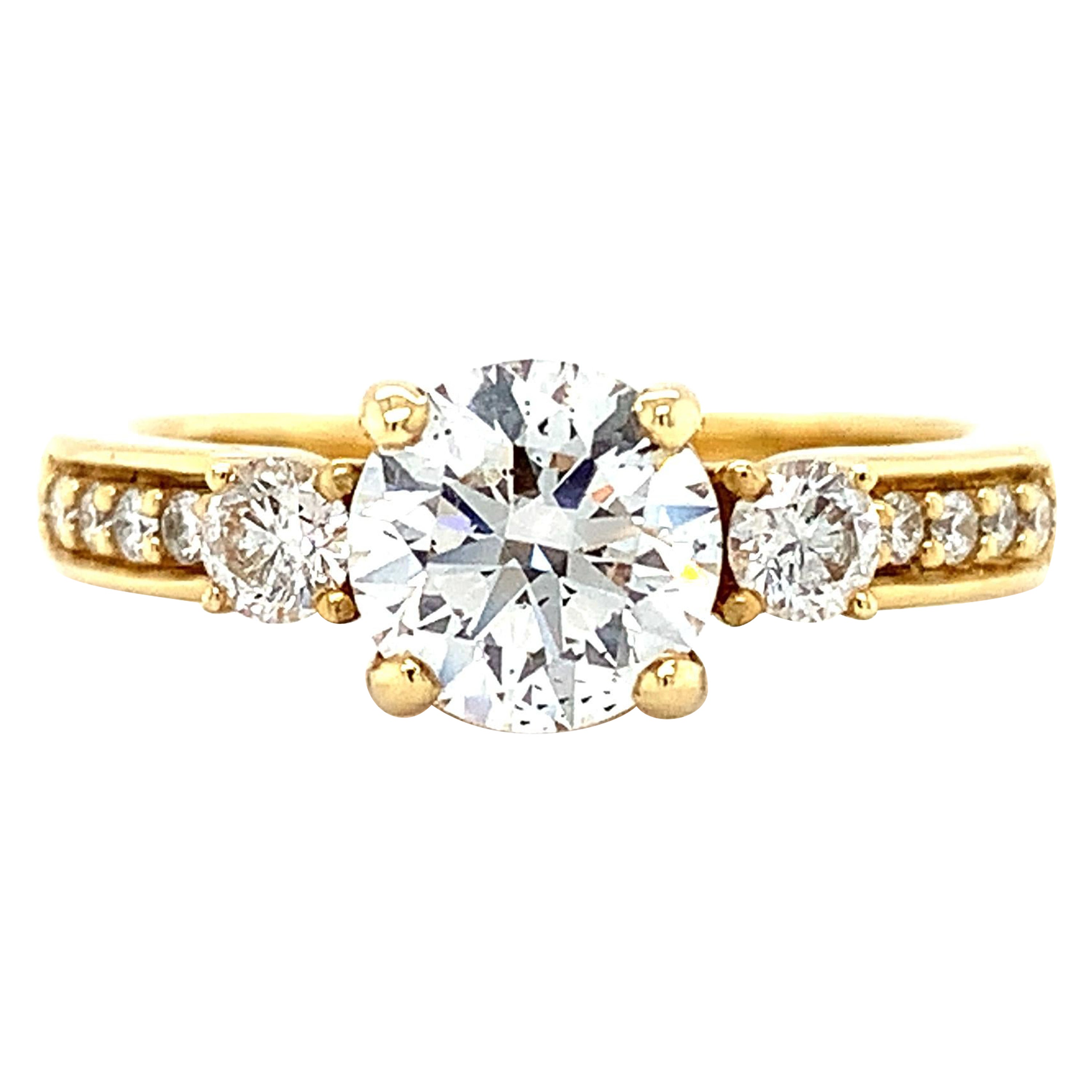 Diamond trilogy three stone engagement ring 18k yellow gold