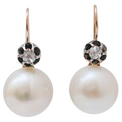 Pendientes de 0,60 quilates de diamantes, 16 mm de perlas, oro rosa y plata.