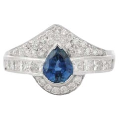 Regal Pear Cut Sapphire Diamond Wedding Ring in 18K White Gold