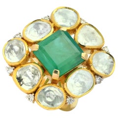 An 18 K Octagon natural emerald ring with Diamond Polki (flat uncut diamonds)