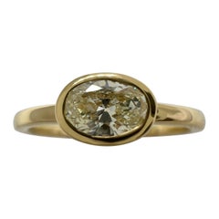 Natural Oval Cut Light Yellow Diamond 18k Yellow Gold Solitaire East West Ring