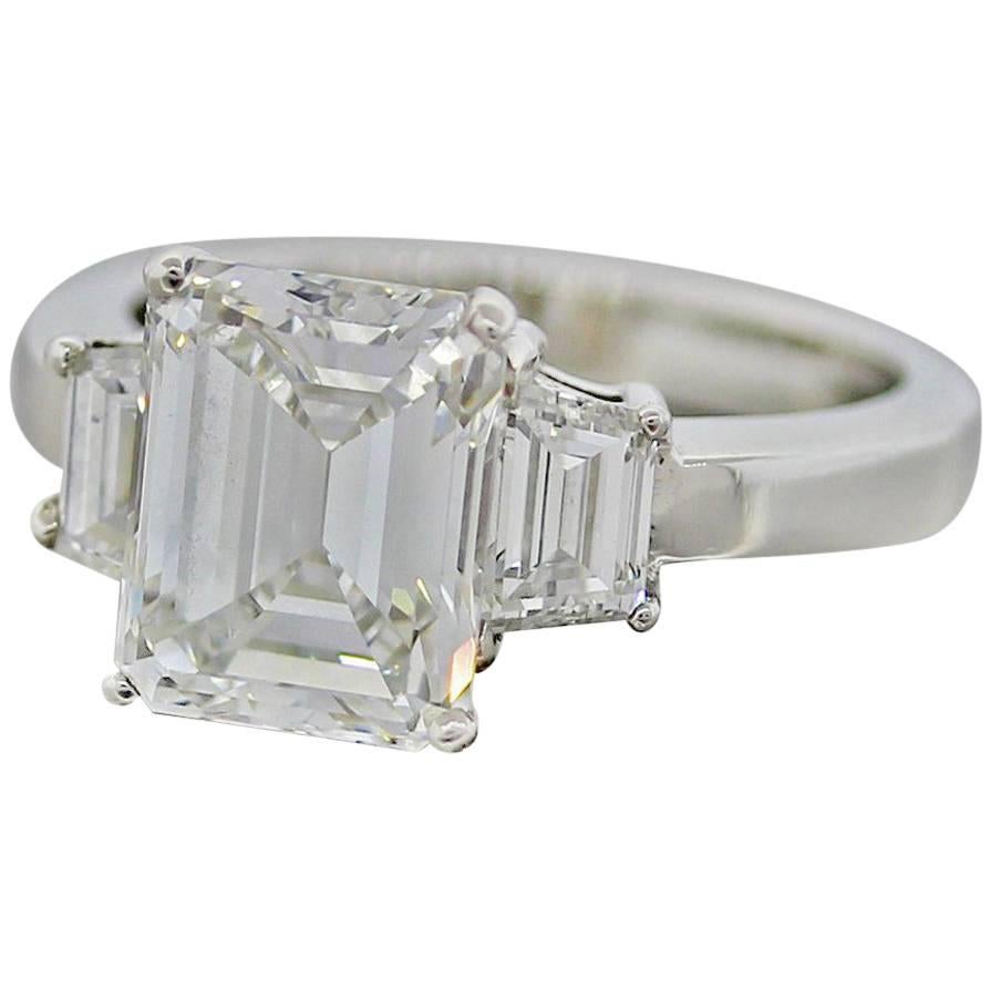 Gorgeous 3.90 carat GIA Emerald Cut Diamond Platinum 3 Stone Engagement Ring For Sale