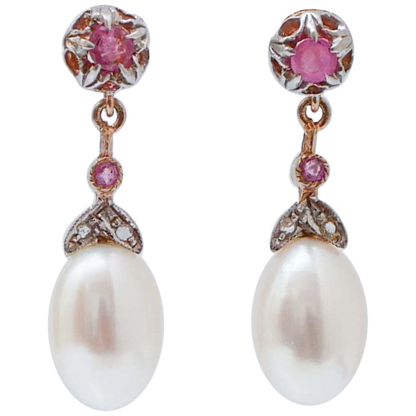 Pendientes de perlas, rubíes, diamantes, oro rosa y plata.