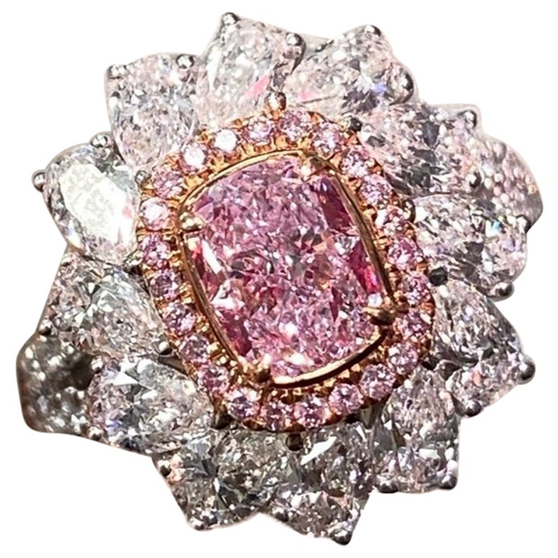 1.05ct center diamond
Light Pink Cushion Diamond
SI2 clarity
GIA Certified Diamond
2.16ct surrounding white mixed shape diamonds
0.12ct Surrounding Pink Diamonds 
Crafted in 18k white gold
Handmade in NYC

This piece can be viewed before purchase in