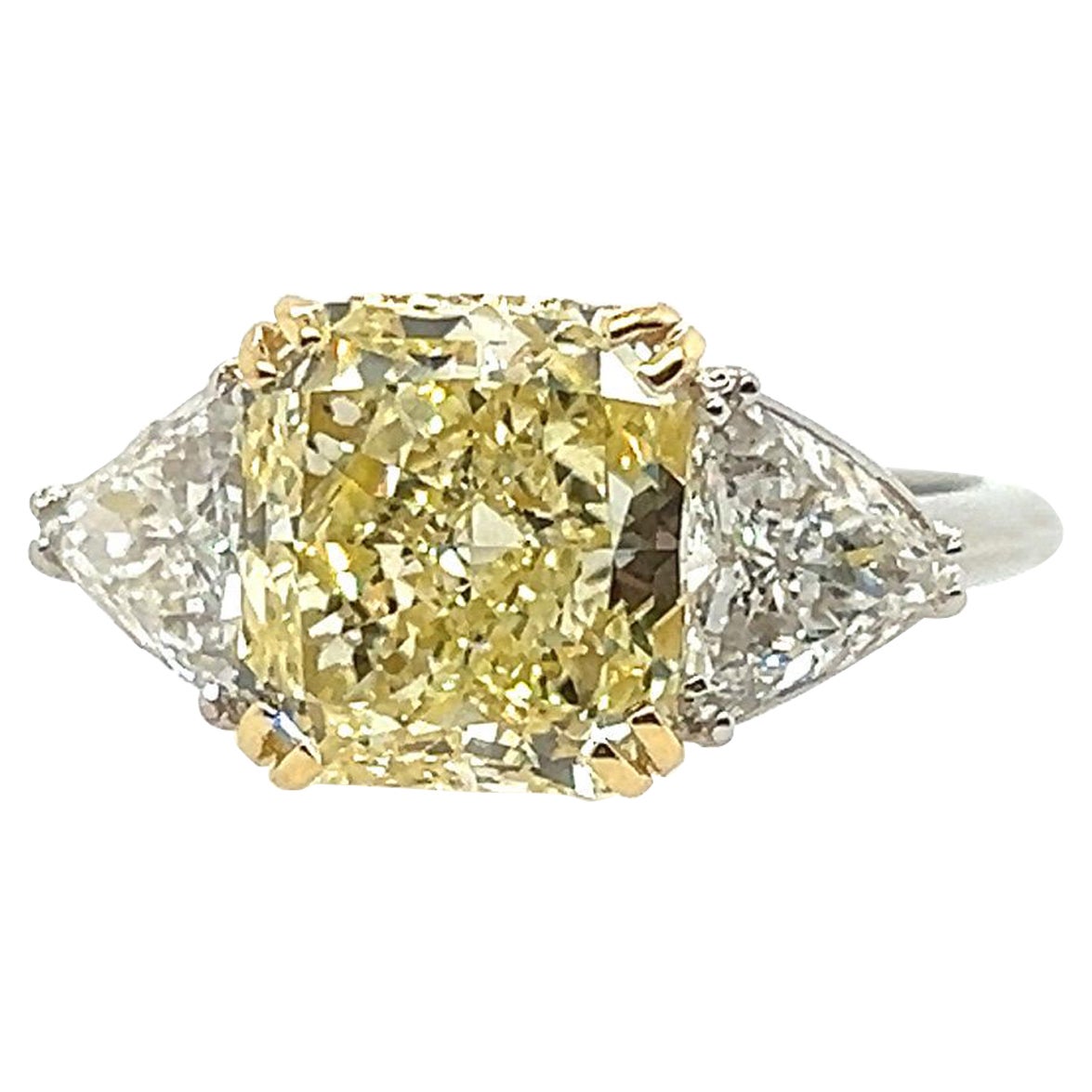 GIA Certified 5.75 Carat Fancy Light Yellow Natural Diamond Plat Engagement Ring For Sale