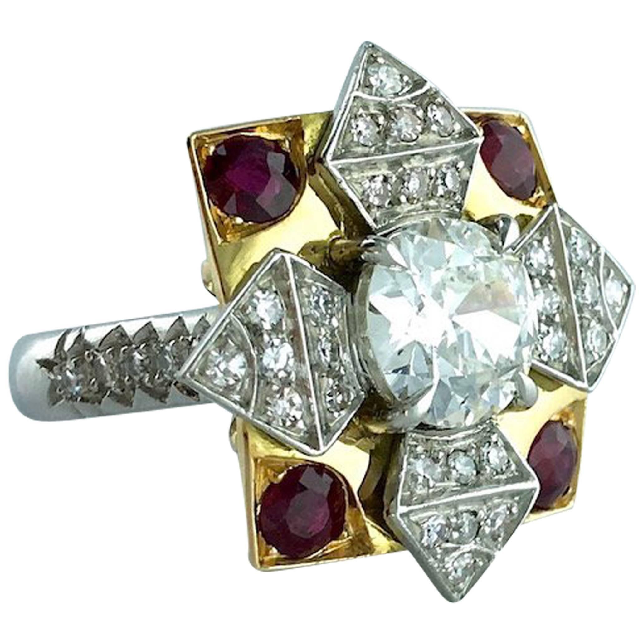 Stylized Flower star platinum and yellow gold 18k 75 ring centered by a round diamond weighting 2.05 carats and surrounded by diamond and ruby.

French assay marks.
Gross weight: 12.90 grams.