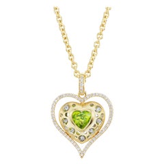 18kt. Cuore su catena con pietra a forma di cuore colorata e circa 0,71 carati di diamanti