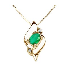 Pendentif de style coquillage naturel, émeraude ovale et diamants en or jaune 18 carats