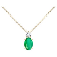 Colgante solitario de esmeralda ovalada natural con diamante en oro amarillo de 18 quilates