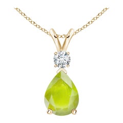 Colgante lágrima de peridoto natural de 1,1 ct con diamante en oro amarillo de 14 quilates