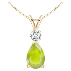 Colgante lágrima de peridoto natural de 1,6 ct con diamante en oro amarillo de 14 quilates