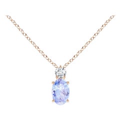 Colgante solitario de tanzanita oval natural con diamante en oro rosa de 18 quilates