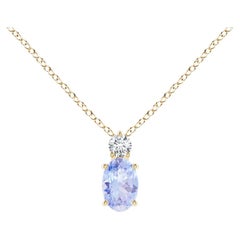 Natural Oval Tanzanite Solitaire Pendant with Diamond in 18K Yellow Gold