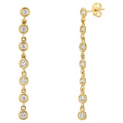 Boucles d'oreilles pendantes en or jaune massif 14K avec diamants.