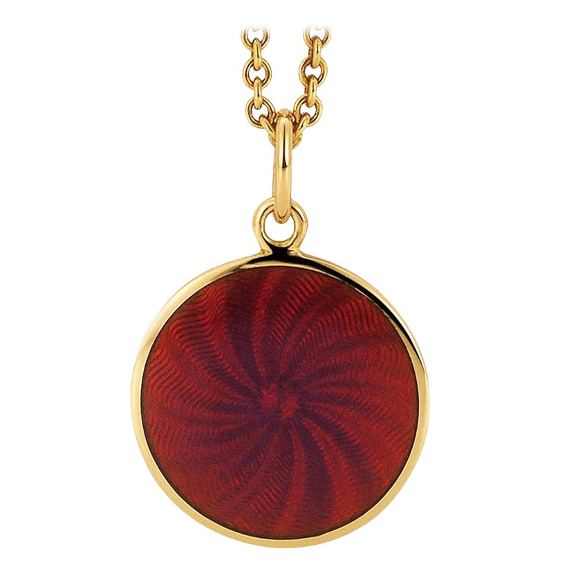 Collana con ciondolo a forma di disco rotondo in oro giallo 18k con smalto guilloche lampone