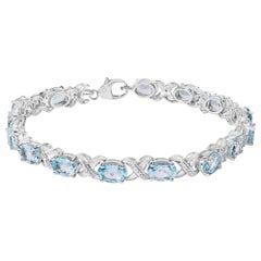 Bracciale Tennis X in argento Sterling 16.0ct con Topazio Blu Ovale e Accenti di Diamanti