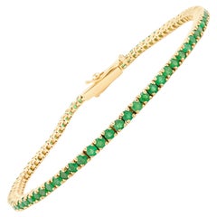 Bracciale minimalista con smeraldo impilabile in oro giallo massiccio 18 ct.