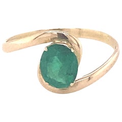 Oval Cut Emerald Yellow Gold Solitaire Ring