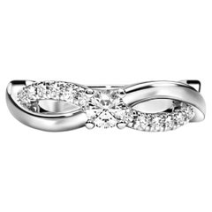 Round diamond moissanite spiral 14k gold ring.