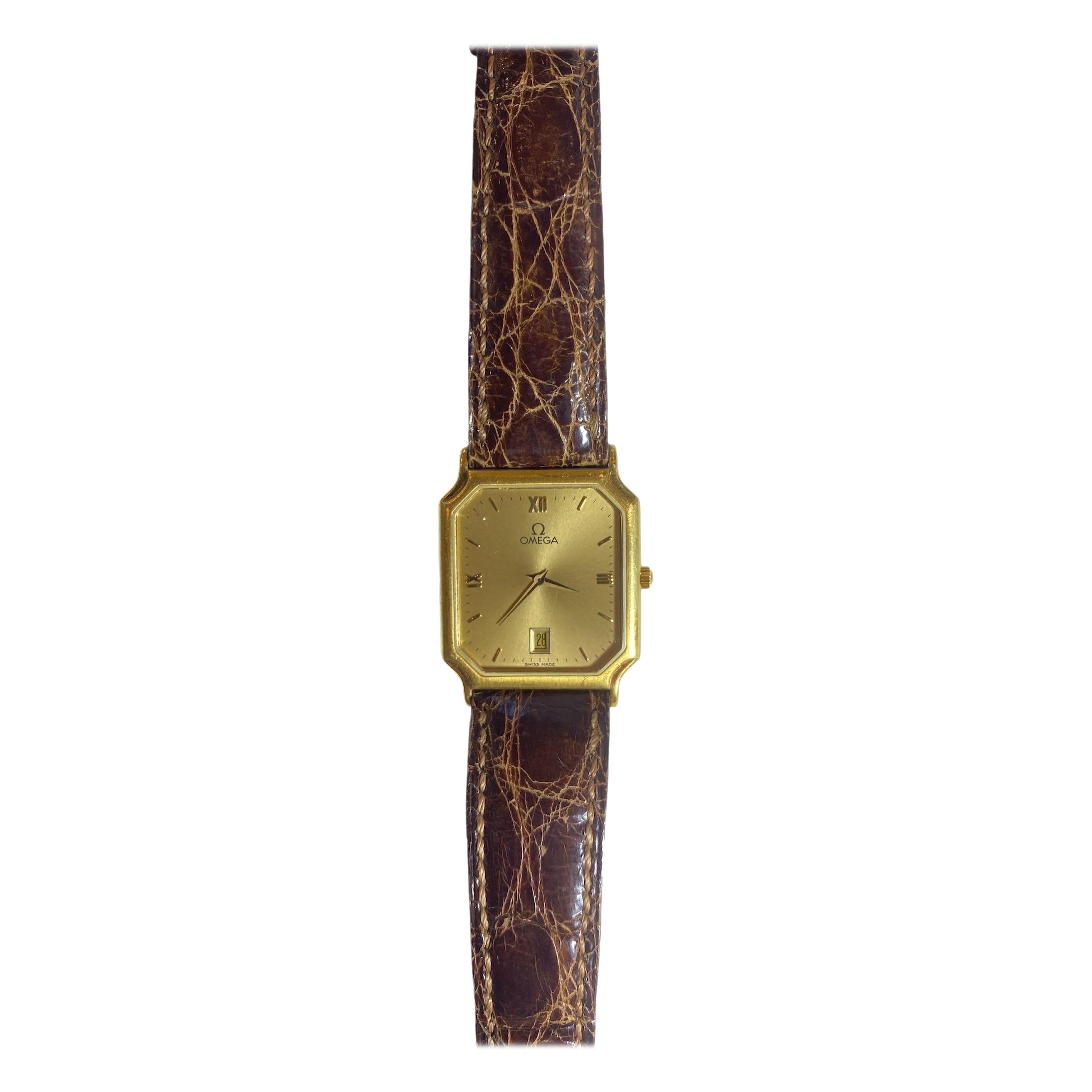 .
‏Vintage Omega Gold-Plated Rectangular Watch with Brown Leather Strap