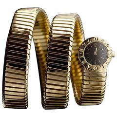 Retro Bulgari Ladies Yellow Gold Tubogas Serpentine Black Dial Quartz Wristwatch