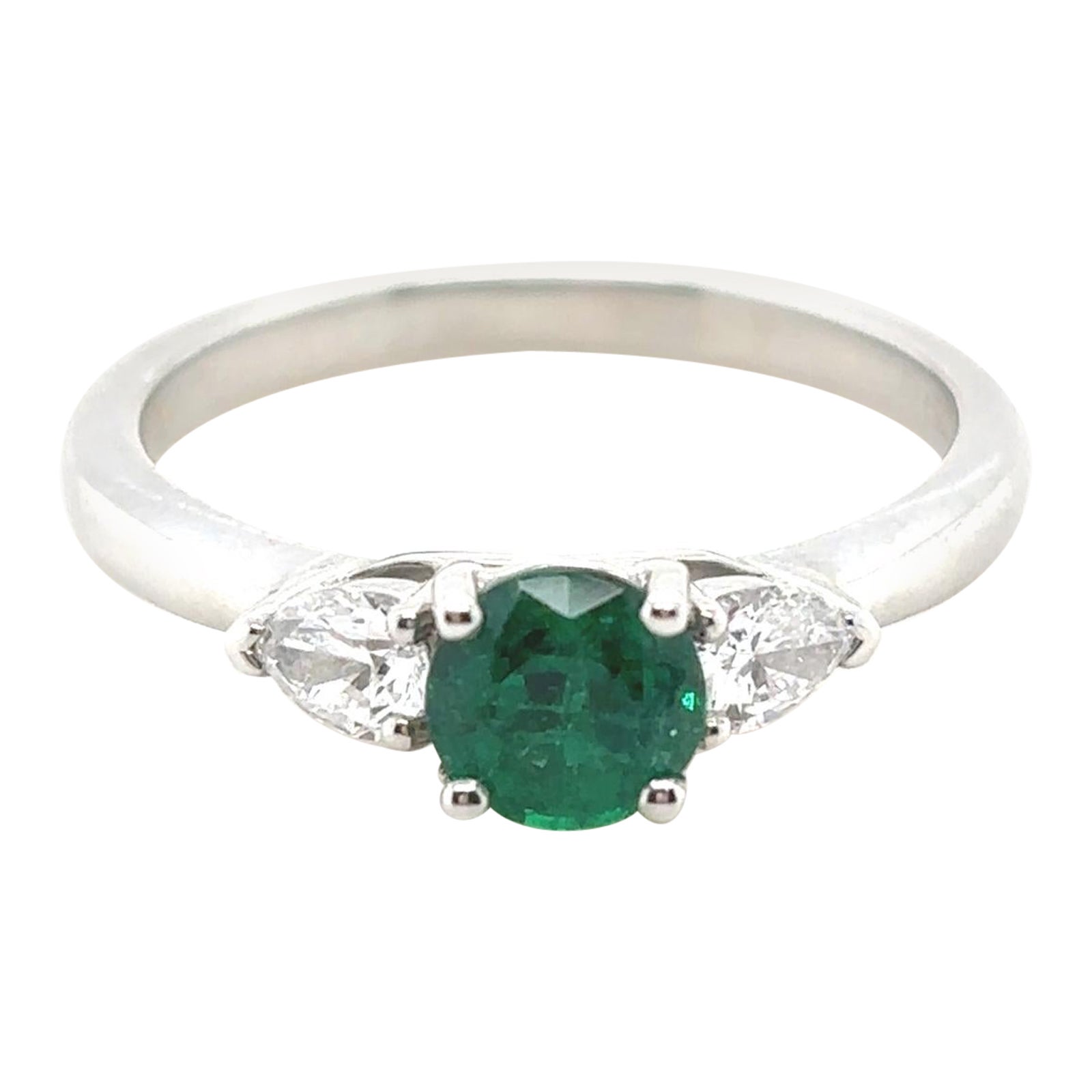 0.60 Carat Emerald and Diamond Three Stone Platinum Engagement Ring