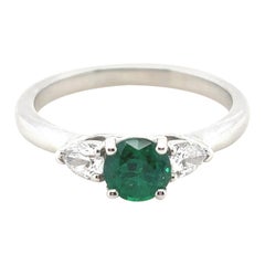0.60 Carat Emerald and Diamond Three Stone Platinum Engagement Ring