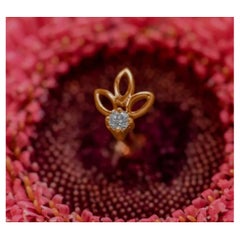 Épingle à nœud de diamant en or jaune 14 carats perçant un bijou canari avec diamants