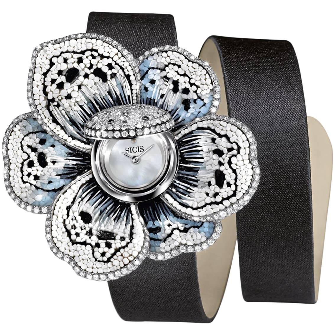 Die stilvolle Armbanduhr mit weißem und schwarzem Diamant-Quarz-Uhrwerk aus Weißgold