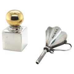 Bottiglia di profumo e imbuto in argento d'epoca