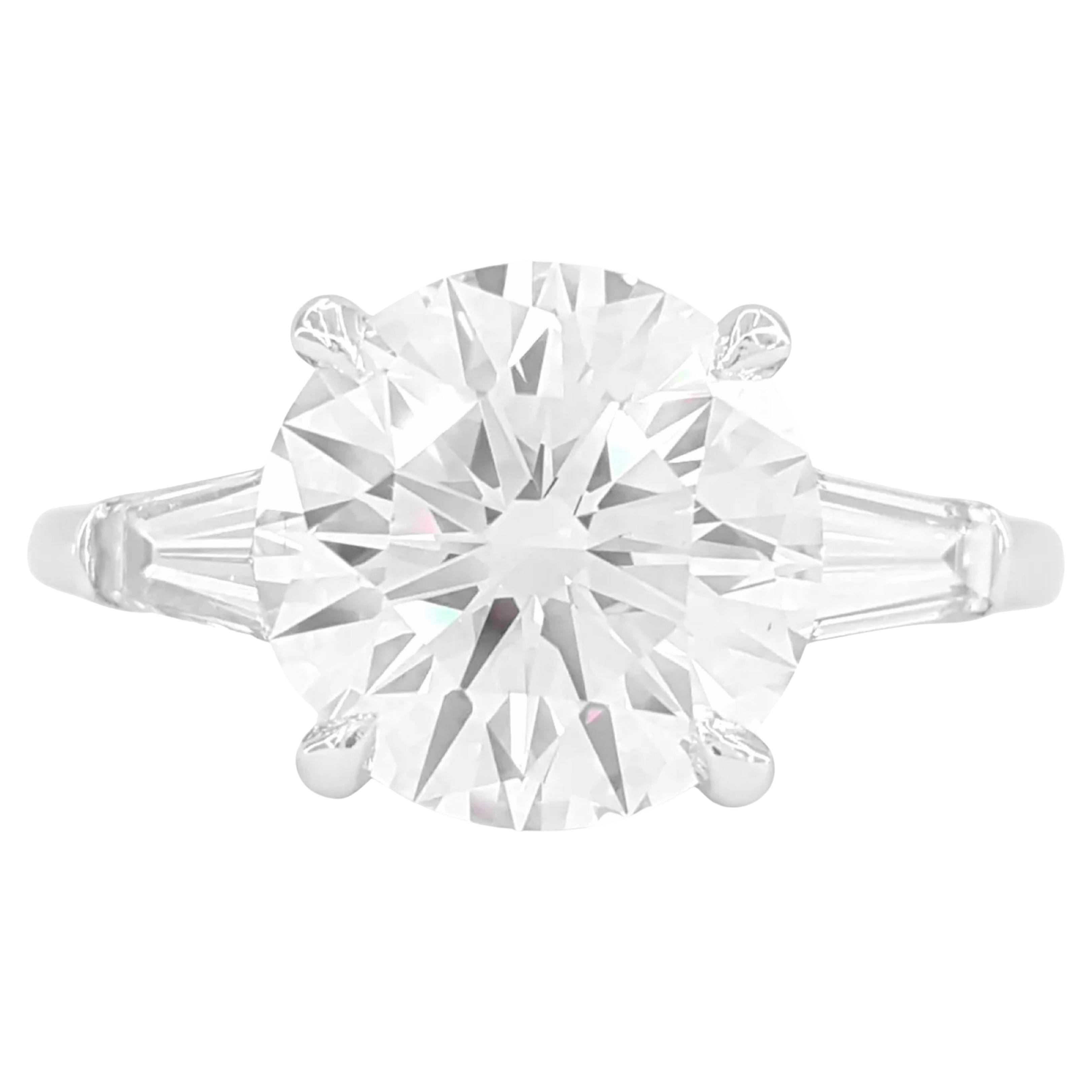 GIA Certified 5 Carat Round Brilliant Cut Diamond Ring with tapered baguette