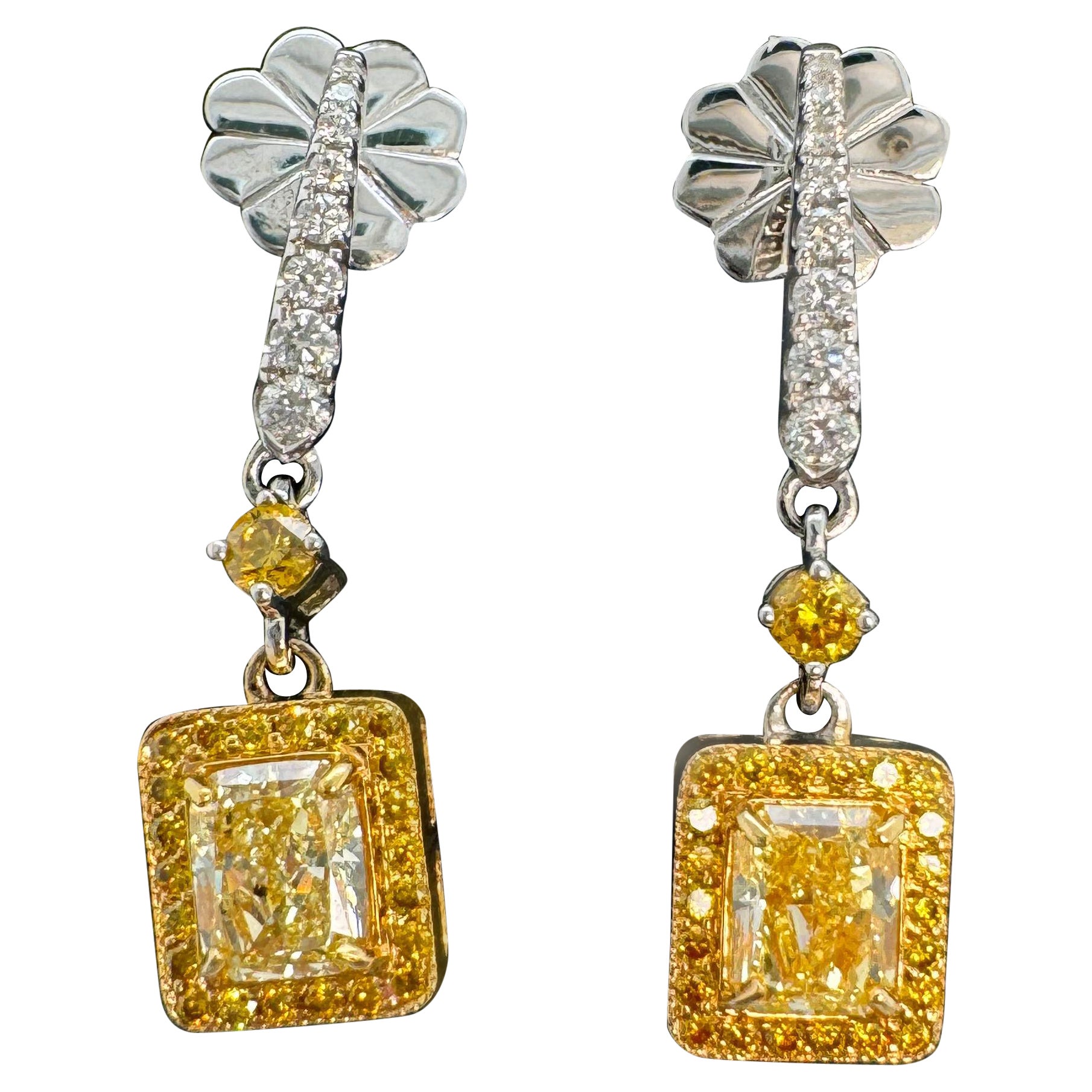 GIA Certified 1.29 Carats Fancy Yellow Diamond Earrings in 18k White Gold