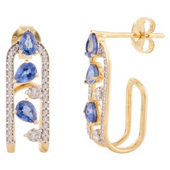Pendientes de boda de diseño en forma de U de zafiro azul con diamantes en oro amarillo de 18k