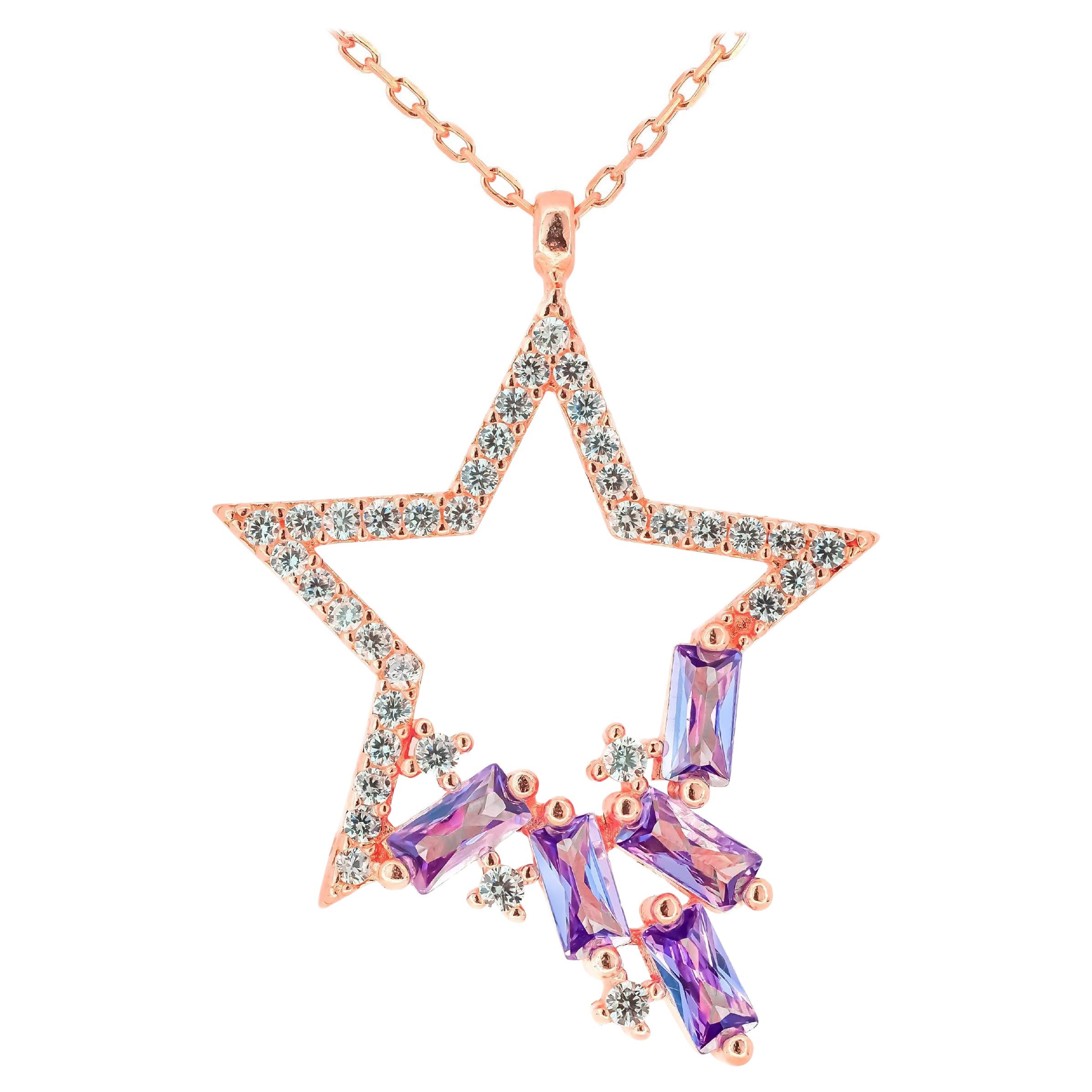 Star pendant necklace in 14k gold.