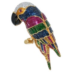 Broche en forme de perroquet sertie de saphirs précieux, rubis, tsavorites et diamants 18 carats