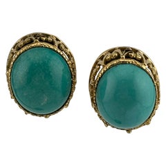 Boucles d'oreilles Omega Back en or jaune 14 carats avec turquoise cabochon