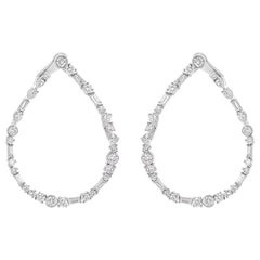 Orecchini a cerchio contemporanei con diamante incolore in oro bianco 18KT di HARAKH