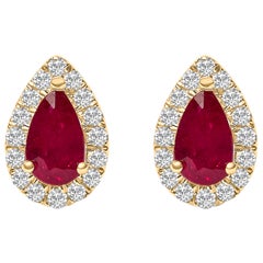10K Yellow Gold 5X3 MM Ruby and 1/7 Cttw Diamond Halo Stud Earrings