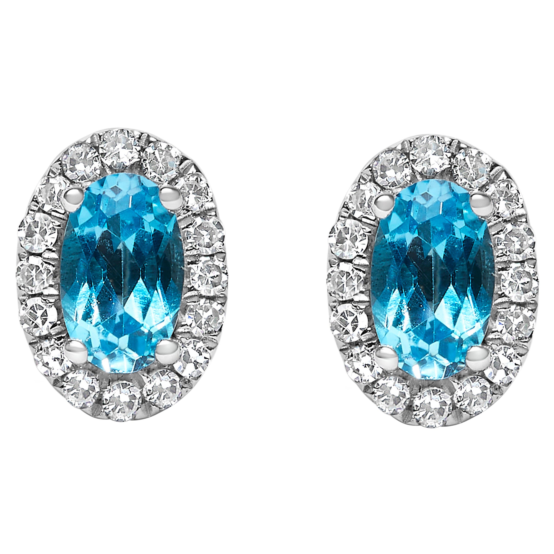 10K White Gold 5x3 MM Oval Blue Topaz and Diamond Halo Stud Earrings