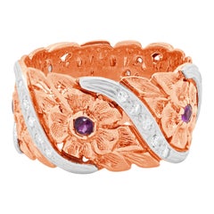 Anillo flor de rubíes y diamantes en platino y oro rosa de 14 quilates