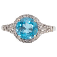 Vintage 1.0 Carat Blue Topaz and Diamond Halo 14 Karat White Gold Ring