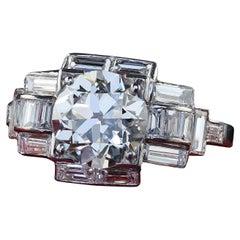 Antiker Art-Déco-Verlobungsring aus Platin mit altem Eurodiamant und Baguette-Diamant im Art déco-Stil - GIA