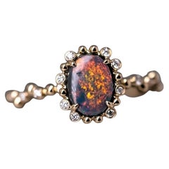 Verlobungsring aus 18 Karat Gelbgold mit schwarzem Opal und Diamant in Blasen-Tee-Design