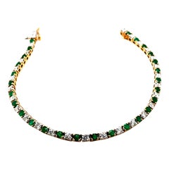 Bracciale con diamanti e smeraldi in oro giallo 9k